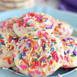 Blue plate topped with sprinkle sugar cookies.