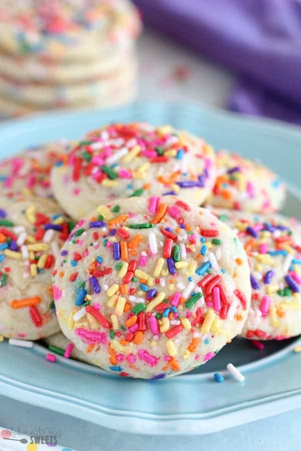 Blue plate topped with sprinkle sugar cookies.