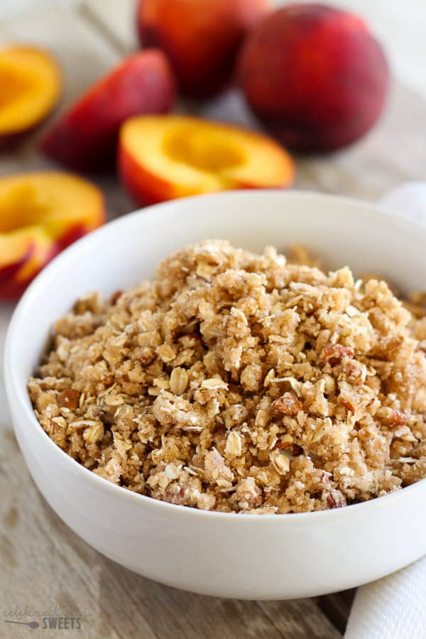 White bowl filled with streusel crumb topping. 