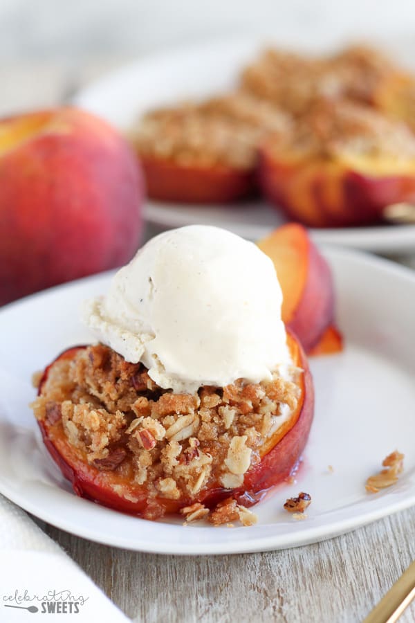 Peaches stuffed with streusel and topped with ice cream.