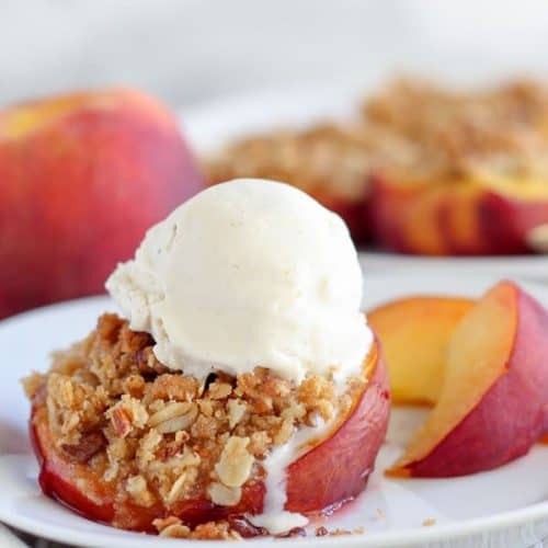 Peaches stuffed with streusel and topped with ice cream.