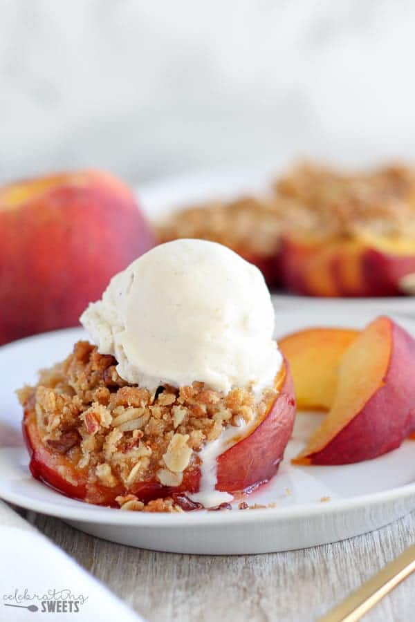 Peaches stuffed with streusel and topped with ice cream.