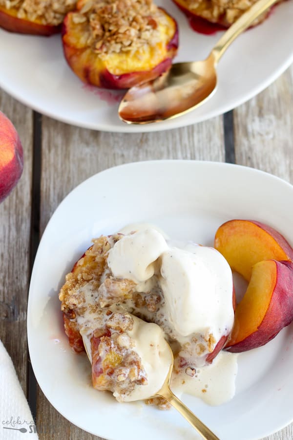 Peaches stuffed with streusel and topped with ice cream.