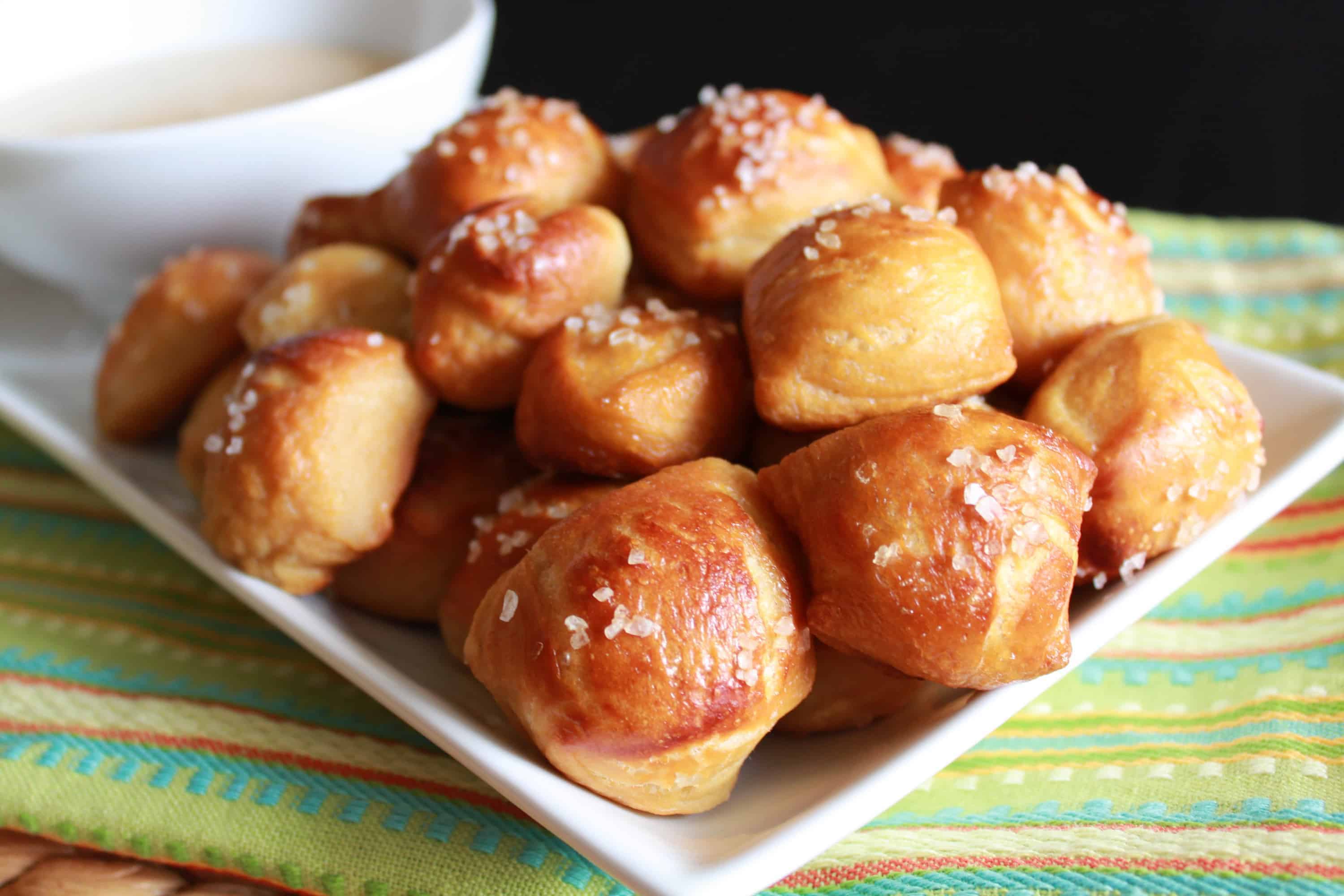 White plate filled with pretzel bites. 