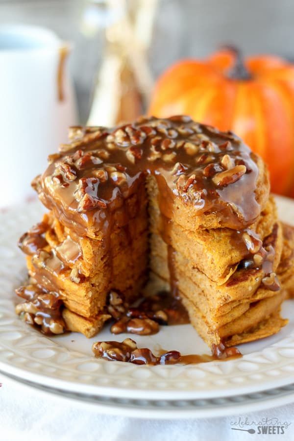 Stack of pumpkin pancakes topped with pecan syrup.