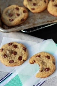 Chocolate chip cookies on parchment paper. 