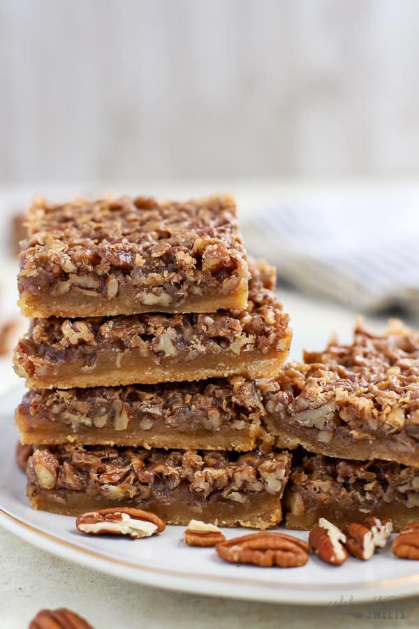 Maple Pecan Pie Bars on a white plate.