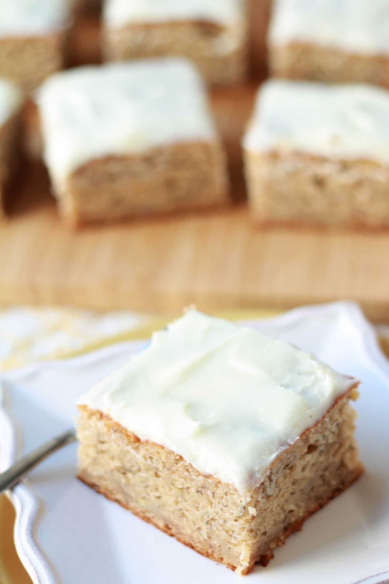 Slices of cake on a wooden board and a white plate. 