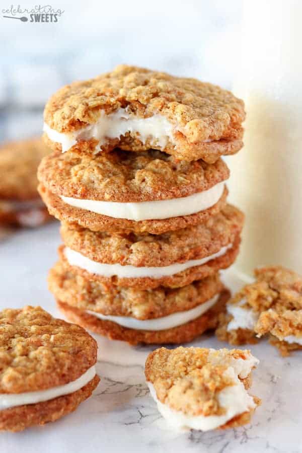 Stack of carrot cake cookies filled with frosting. 
