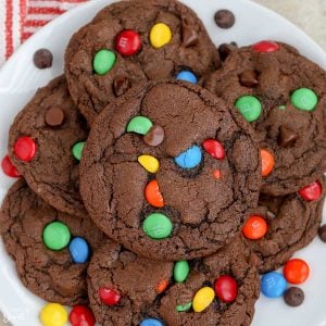 Chocolate M&M Cookies on a white plate.