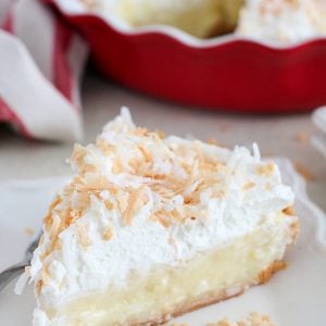 Coconut Cream Pie on a white plate.