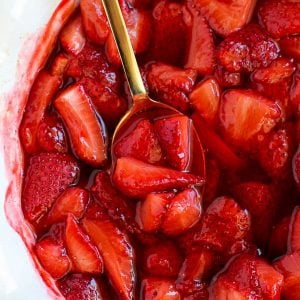 Juicy roasted strawberries in a baking dish.