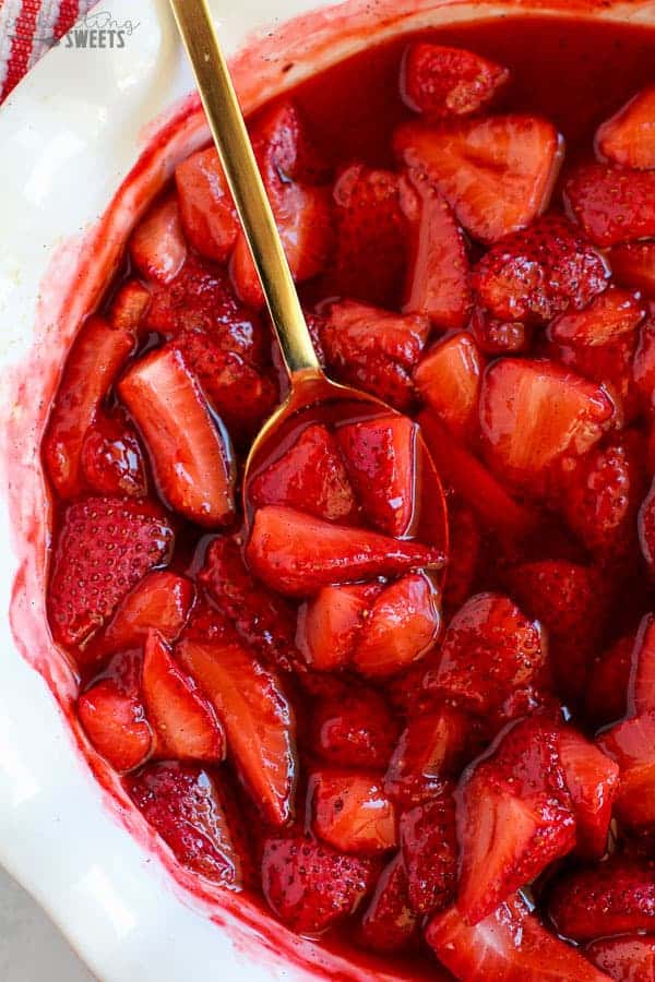 Juicy roasted strawberries in a baking dish.
