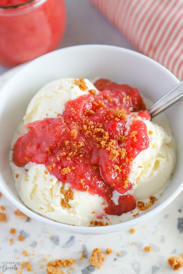 Rhubarb Sauce over vanilla ice cream in a white bowl. 