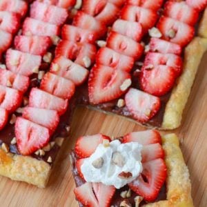 Fruit tart on a wooden board.