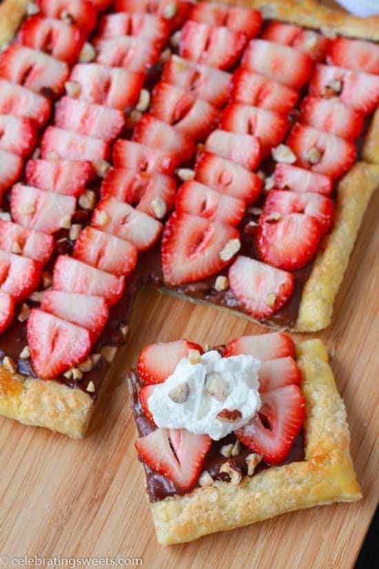 Fruit tart on a wooden board.