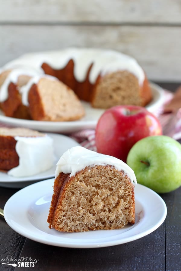 Slice of apple bundt cake on a white plate. 