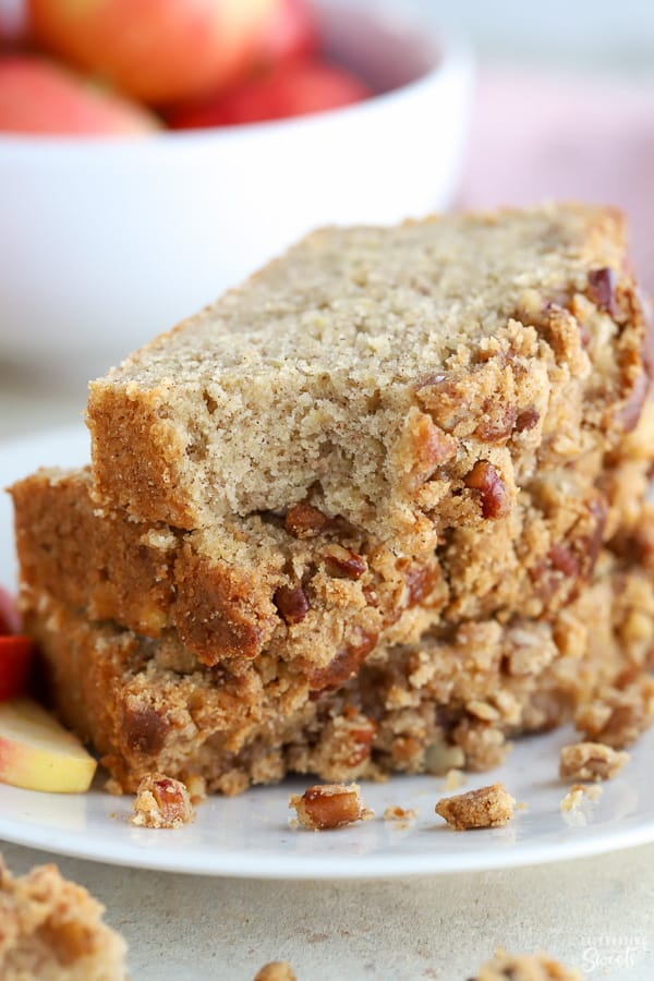 Three slices of apple bread stacked on top of each other. 