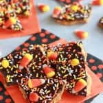 Toffee bark topped with candy corn and halloween sprinkles.