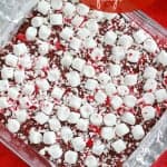 Baking dish of fudge topped with marshmallows and crushed candy canes.
