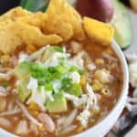 Bowl of chicken chili with tortilla chips.