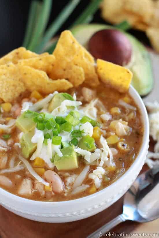 Bowl of chicken chili with tortilla chips. 