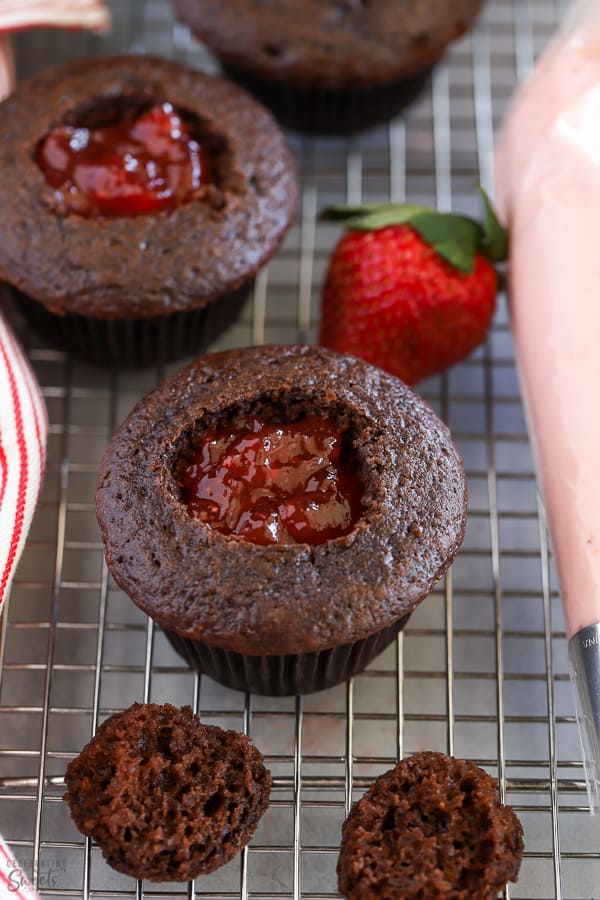 Strawberry jam inside of a chocolate cupcake.