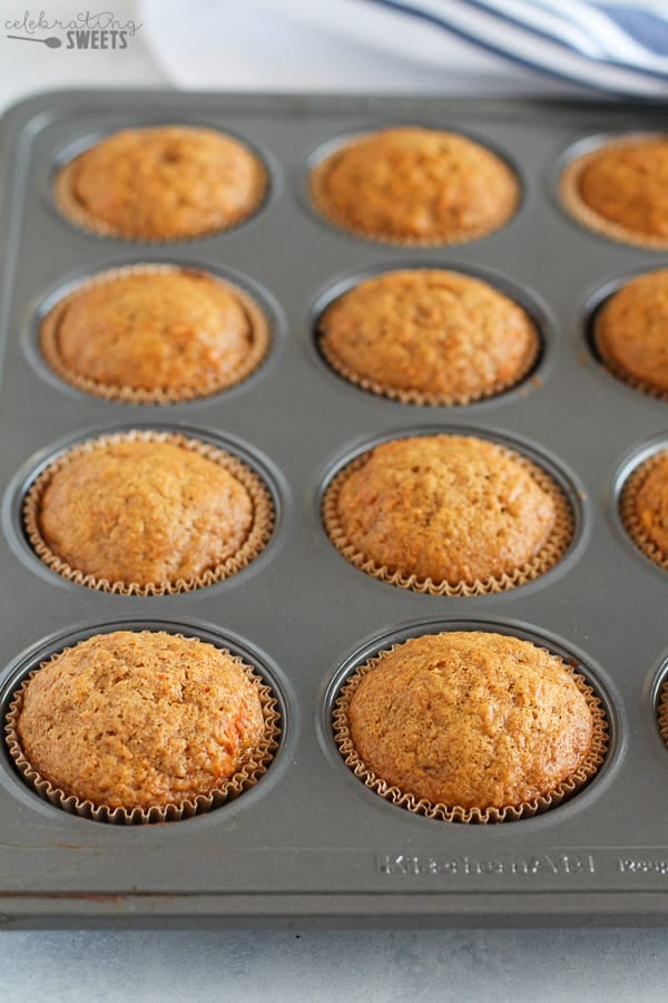 Carrot cake cupcakes in a muffin tin.