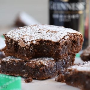 Two Guinness Brownies topped with powdered sugar.
