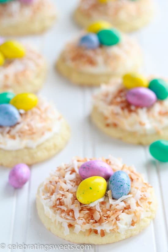 Sugar cookies topped with coconut and egg shaped candies. 
