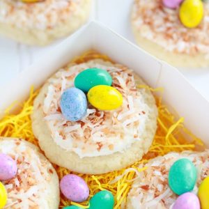 Sugar cookies topped with coconut and egg shaped candies.