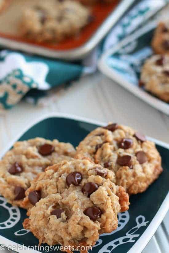 Coconut chocolate chip cookies on a green plate.