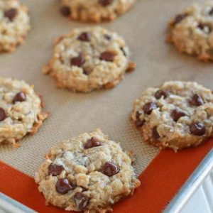 Coconut chocolate chip cookies on a baking sheet.