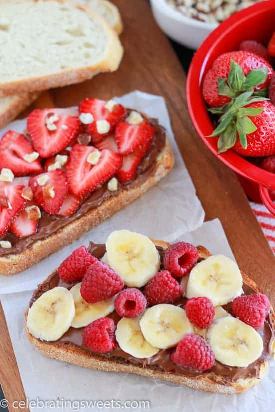 Bread topped with chocolate spread and fresh fruit. 