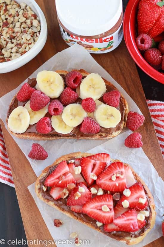 Bread topped with chocolate spread and fresh fruit. 