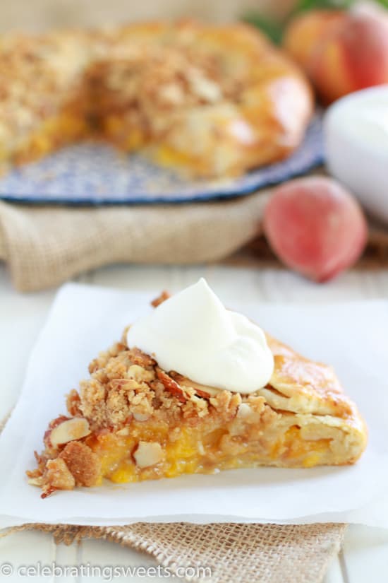 Slice of peach galette on a white plate.