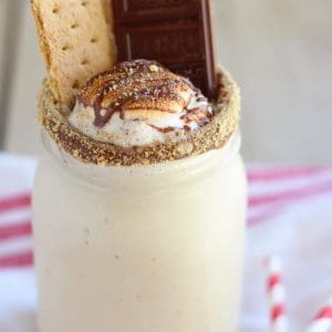 Milkshake topped with toasted marshmallow and chocolate.