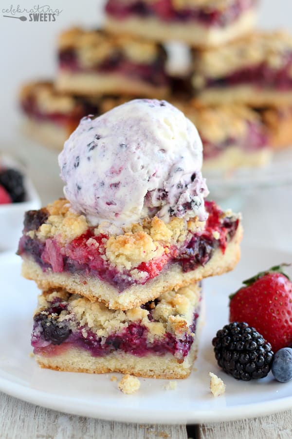 Berry Crumble Bars with a scoop of ice cream on top.