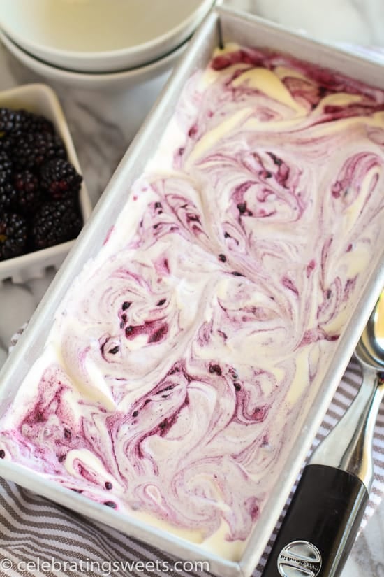 Blackberry vanilla ice cream in a metal loaf pan. 