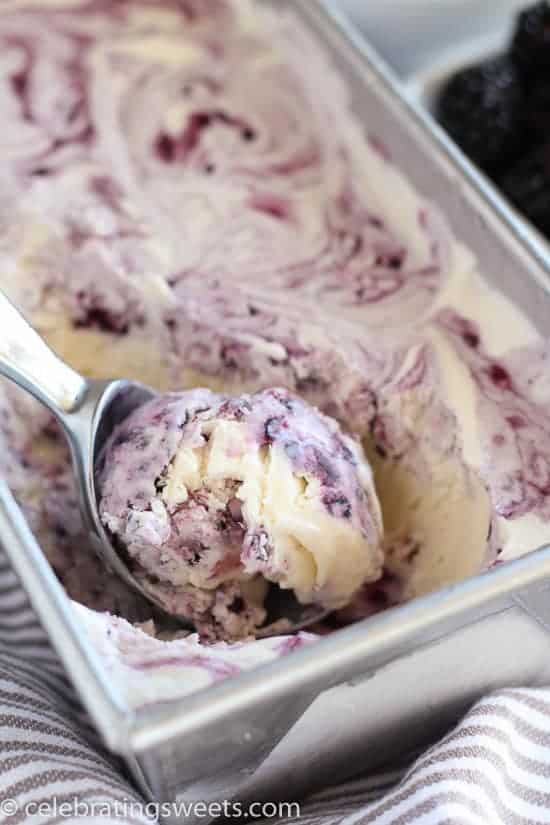 Blackberry vanilla ice cream in a metal loaf pan. 