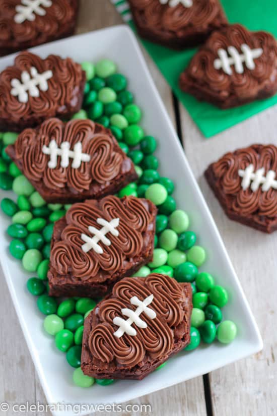 Football shaped brownies on top of green M&M\'s.