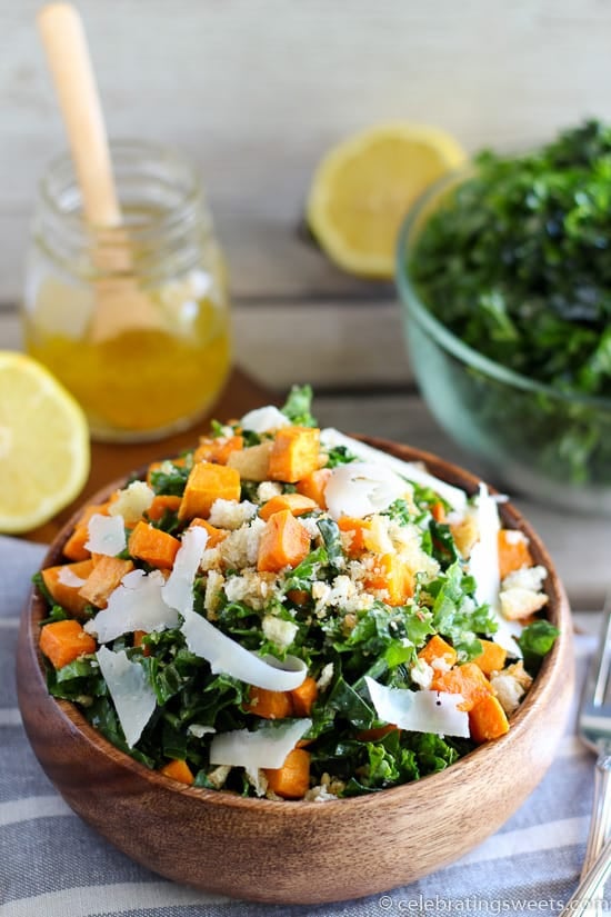 Kale and sweet potato salad in a wooden bowl. 