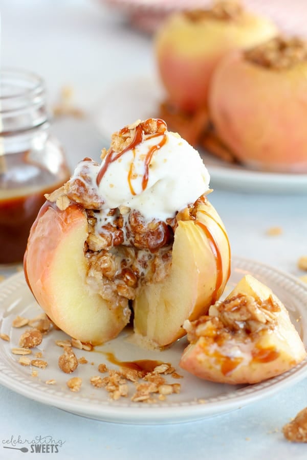 Stuffed apple split open topped with ice cream.