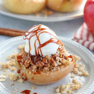 Baked Apple filled with oat crumble and topped with a scoop of vanilla ice cream.