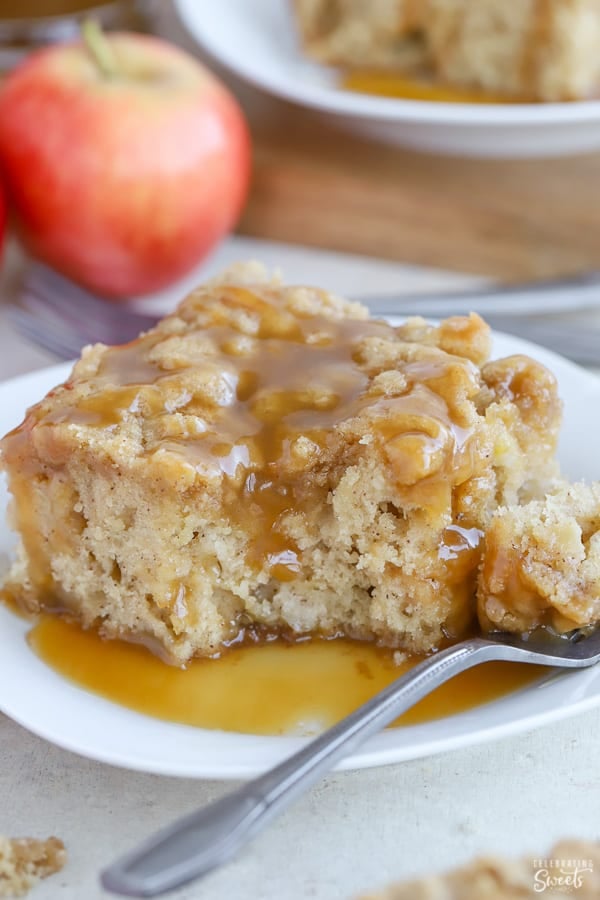 A prick of apple cake on a white plate topped with caramel sauce.  Apple Crumb Cake Apple Cake 3