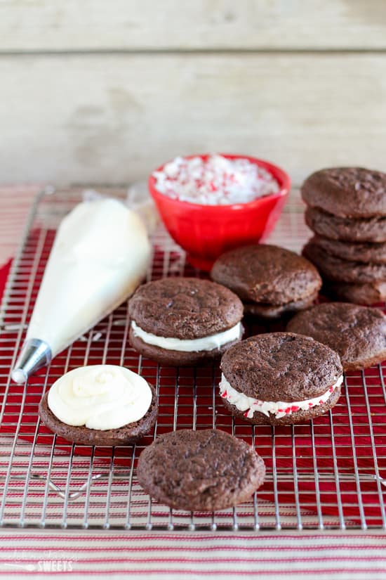 Peppermint sandwich cookies on a cooling rack.