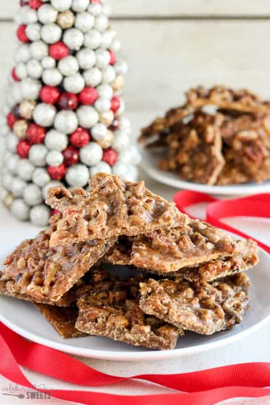 Toffee stacked on a white plate.