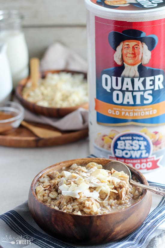 Bowl of oatmeal topped with coconut and almonds. 