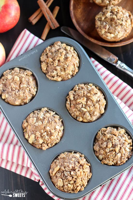 Apple muffins on a muffin tin.