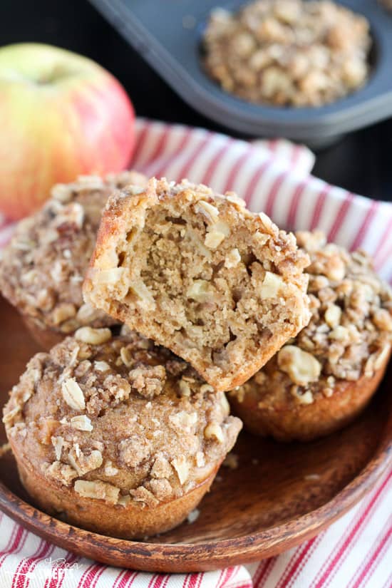 Wooden plate with apple muffins.